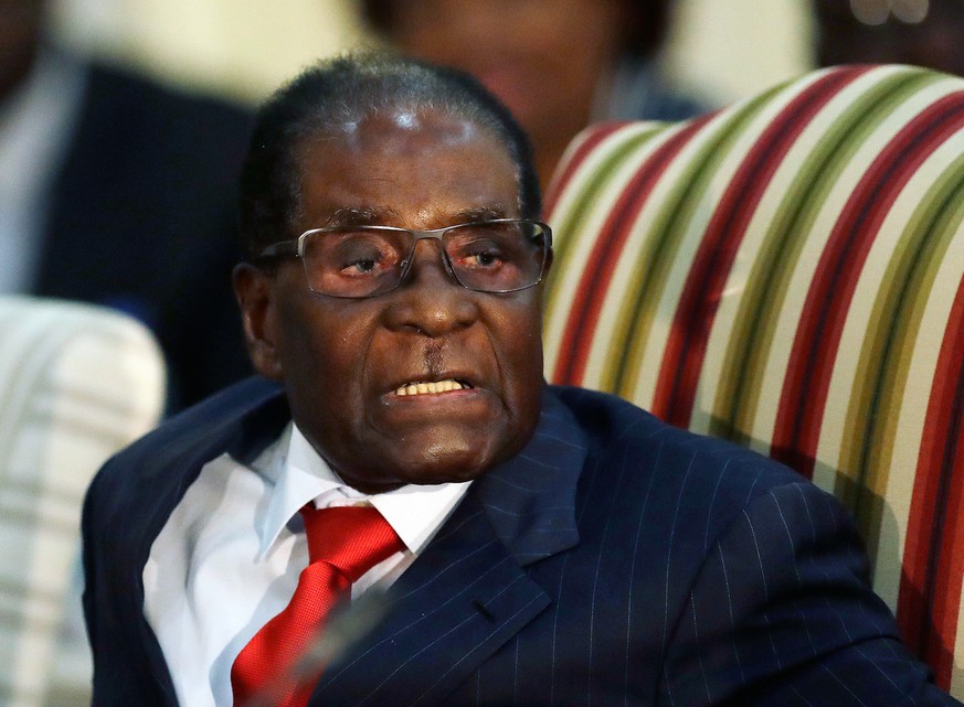 FILE - In this Oct. 3, 2017 file photo, Zimbabwean President Robert Mugabe during a meeting with South African President Jacob Zuma at the Presidential Guesthouse in Pretoria, South Africa. On Friday, ...