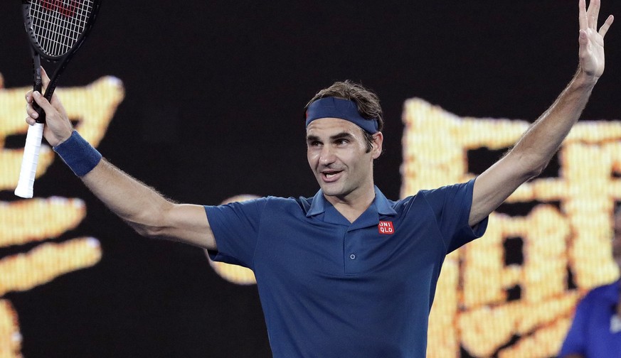 Switzerland&#039;s Roger Federer celebrates after defeating Uzbekistan&#039;s Denis Istomin during their first round match at the Australian Open tennis championships in Melbourne, Australia, Monday,  ...