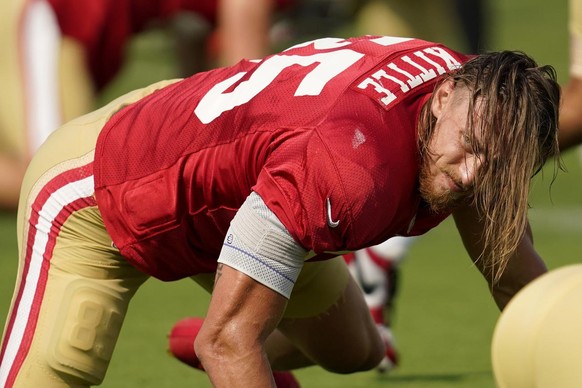 San Francisco 49ers tight end George Kittle stretches during NFL football practice in Santa Clara, Calif., Tuesday, Aug. 18, 2020. (AP Photo/Jeff Chiu, Pool)