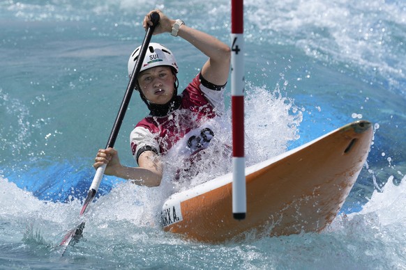Alena Marx of Switzerland competes in the Women&#039;s C1 heats of the Canoe Slalom at the 2020 Summer Olympics, Wednesday, July 28, 2021, in Tokyo, Japan. (AP Photo/Kirsty Wigglesworth)
