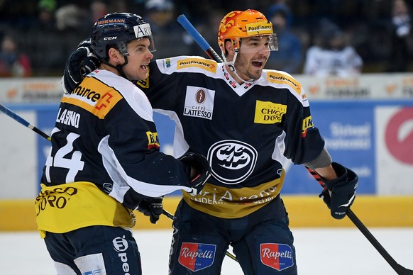 Ambri&#039;s player Matt D&#039;Agostini, right, celebrates with Ambri&#039;s player Nick Plastino, left, the 3-1 goal, during the preliminary round game of National League Swiss Championship between  ...