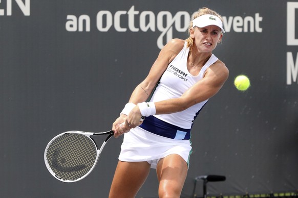 Jil Belen Teichmann returns a shot against Shelby Rogers during action in her WTA tennis tournament semifinal match in Nicholasville, Ky., Saturday, Aug. 15, 2020. (AP Photo/James Crisp)