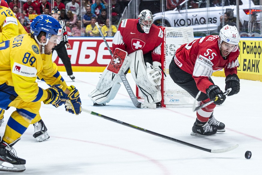 Sweden`s William Nylander, left, against Switzerland&#039;s Romain Loeffel during the game between Sweden and Switzerland, at the IIHF 2019 World Ice Hockey Championships, at the Ondrej Nepela Arena i ...