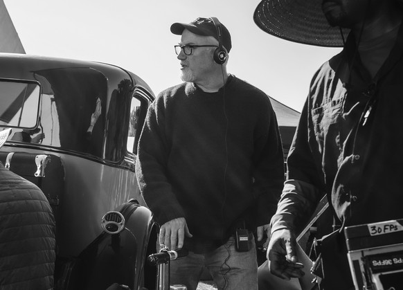 This image released by Netflix shows David Fincher on the set of &quot;Mank.&quot; Fincher was nominated for a Golden Globe for best director on Wednesday, Feb. 3, 2021 for his work on the film. (Gise ...