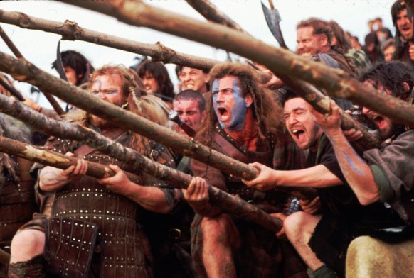 Actor Mel Gibson leads a charge as he stars in the motion picture &quot;Braveheart,&quot; which he also directed. The epic film about a 13th-century Scottish patriot won five Oscars late Monday March  ...