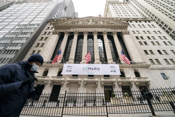 FILE - Pedestrians pass the New York Stock Exchange, Wednesday, Jan. 27, 2021, in New York. Stocks are opening higher on Wall Street following three straight days of losses. The S&amp;P 500 rose 0.2%  ...