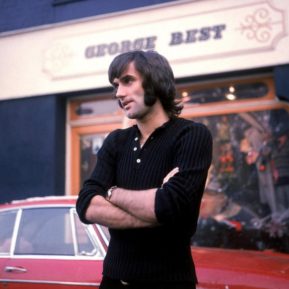 George Best the former Northern Ireland and Manchester United soccer star is seen in this January 1970 photo standing outside his store in Manchester, England. Best who needed a liver transplant three ...