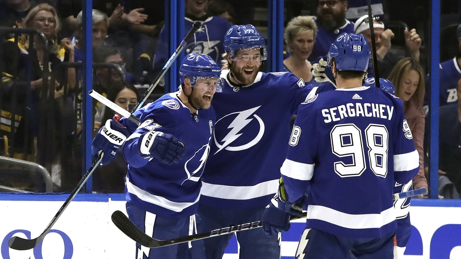 Tampa Bay Lightning center Steven Stamkos (91) celebrates his goal against the Boston Bruins with defenseman Victor Hedman (77) and defenseman Mikhail Sergachev (98) during the first period of an NHL  ...
