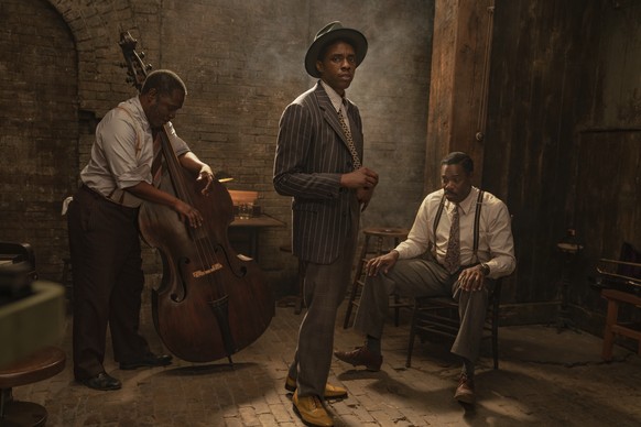 This image released by Netflix shows Michael Potts, from left, Chadwick Boseman and Colman Domingo in &quot;Ma Rainey&#039;s Black Bottom.&quot; Boseman received two posthumous nominations from the Sc ...